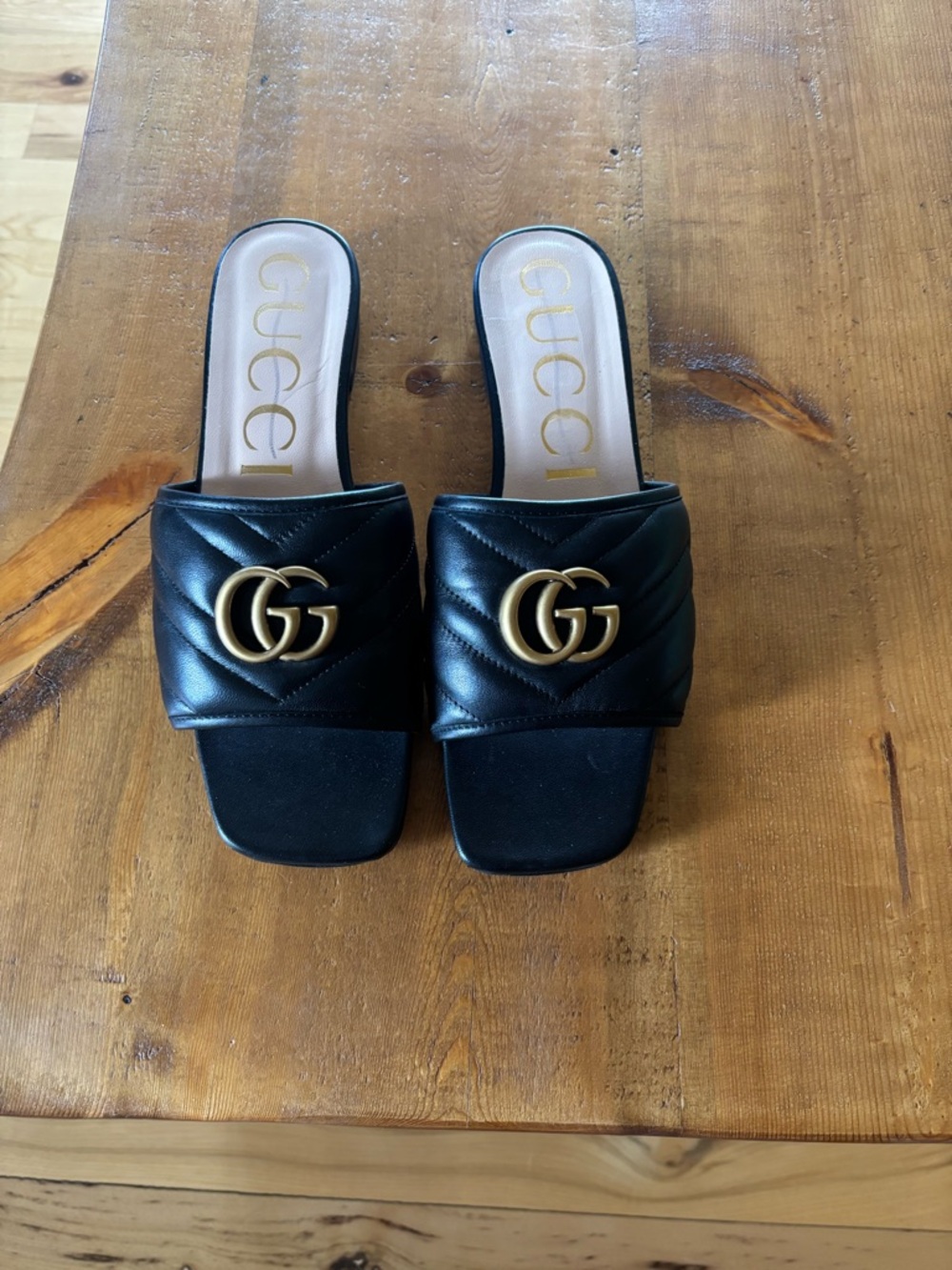 Gucci Black Quilted Leather GG Slide Mules with Gold Hardware